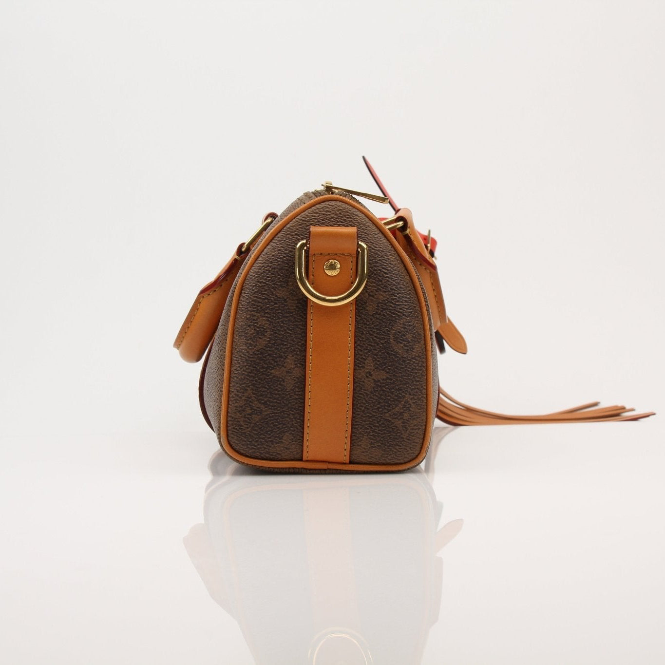 Louis Vuitton Keepall 25 Monogram Canvas handbag with leather trim and gold-tone hardware, displayed on a neutral background.