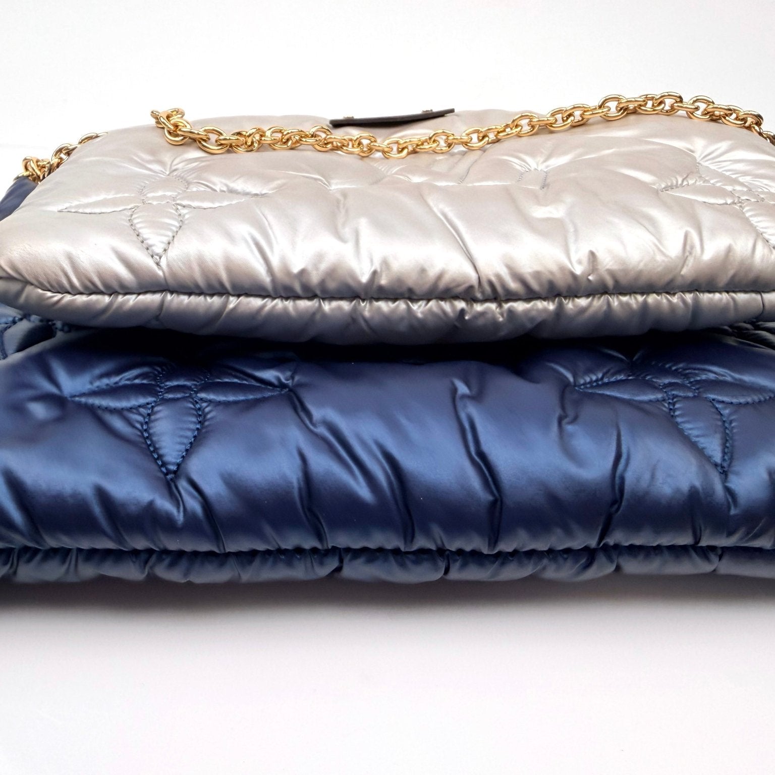 Louis Vuitton Pillow Multi Pochette handbag with gold accents and colorful design, featuring multiple compartments and a stylish handle.