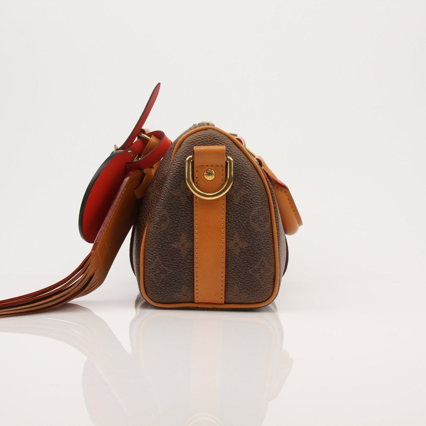 Louis Vuitton Keepall 25 Monogram Canvas Bag handbag with leather trim and silver hardware, displayed on a neutral background.