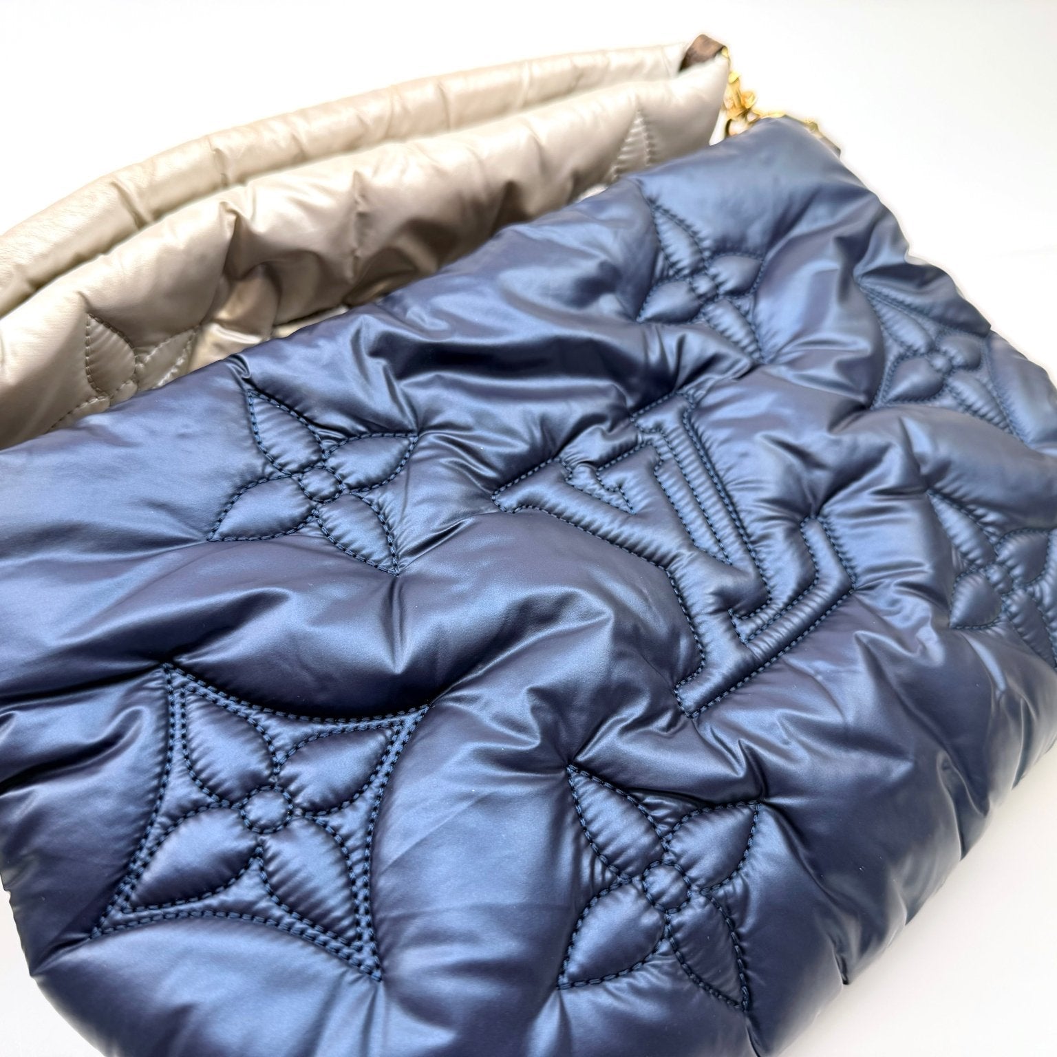 Louis Vuitton Pillow Multi Pochette handbag with gold accents and multiple compartments, stylish accessory for everyday use