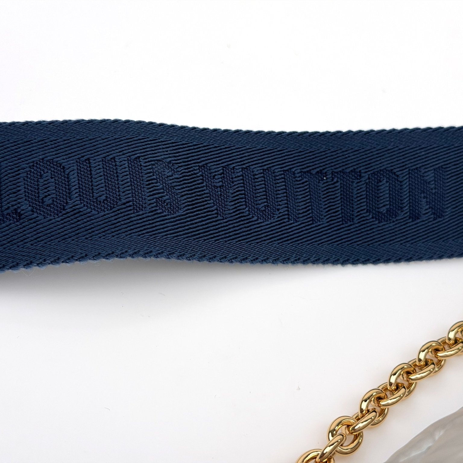 Louis Vuitton Pillow Multi Pochette handbag with gold accents, featuring a soft, padded design and multiple compartments.