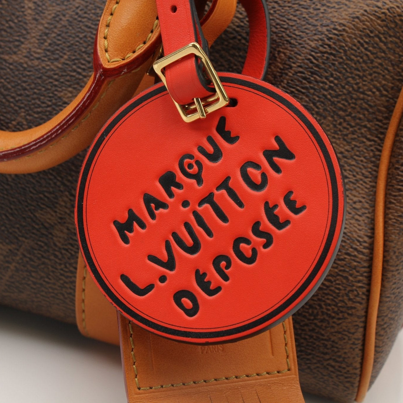 Louis Vuitton Keepall 25 Monogram Canvas handbag with leather trim and zipper closure, featuring the iconic LV monogram pattern.