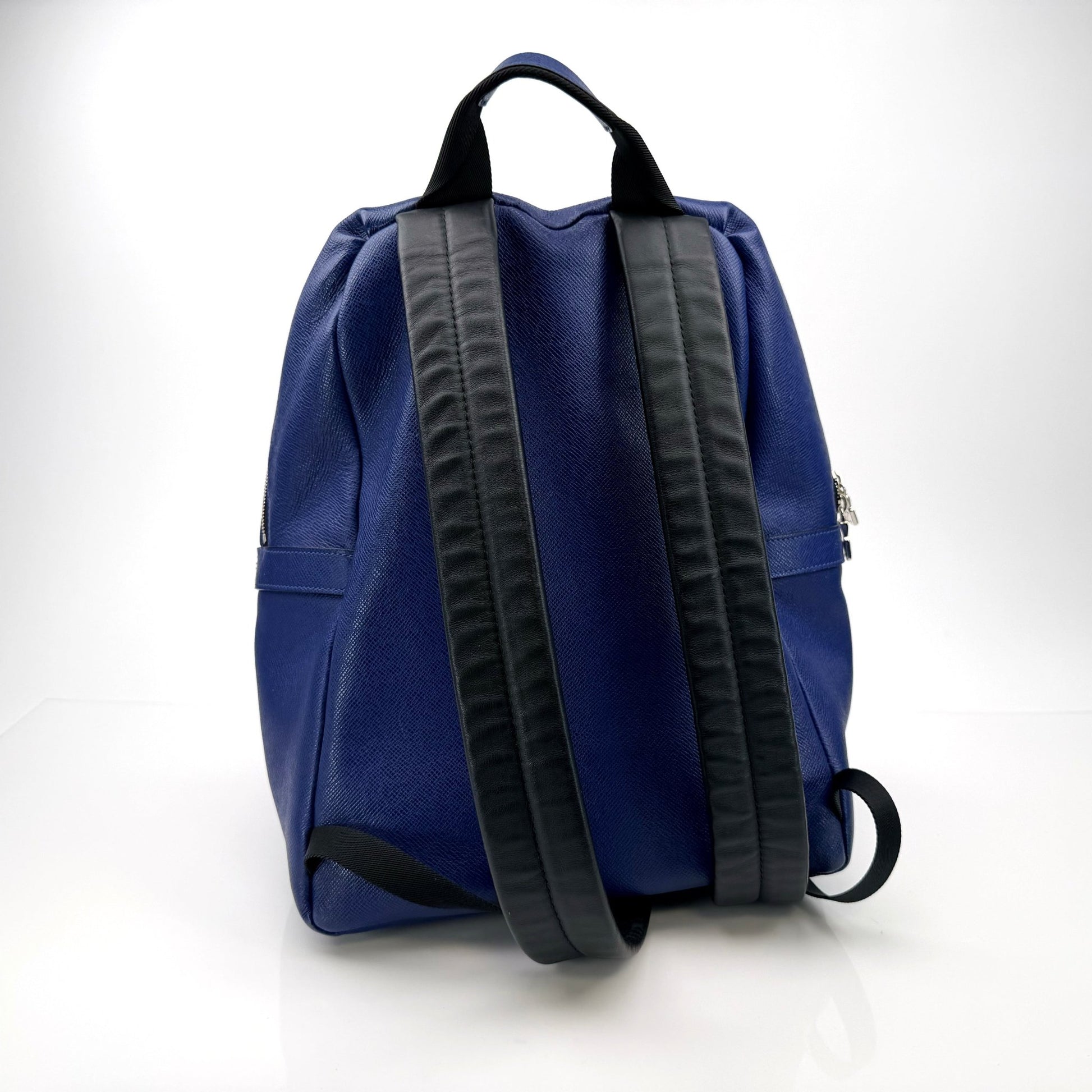 Gold & Beyond Louis Vuitton Discovery Backpack, a stylish travel bag with leather accents and spacious interior, suitable for travel and daily use.