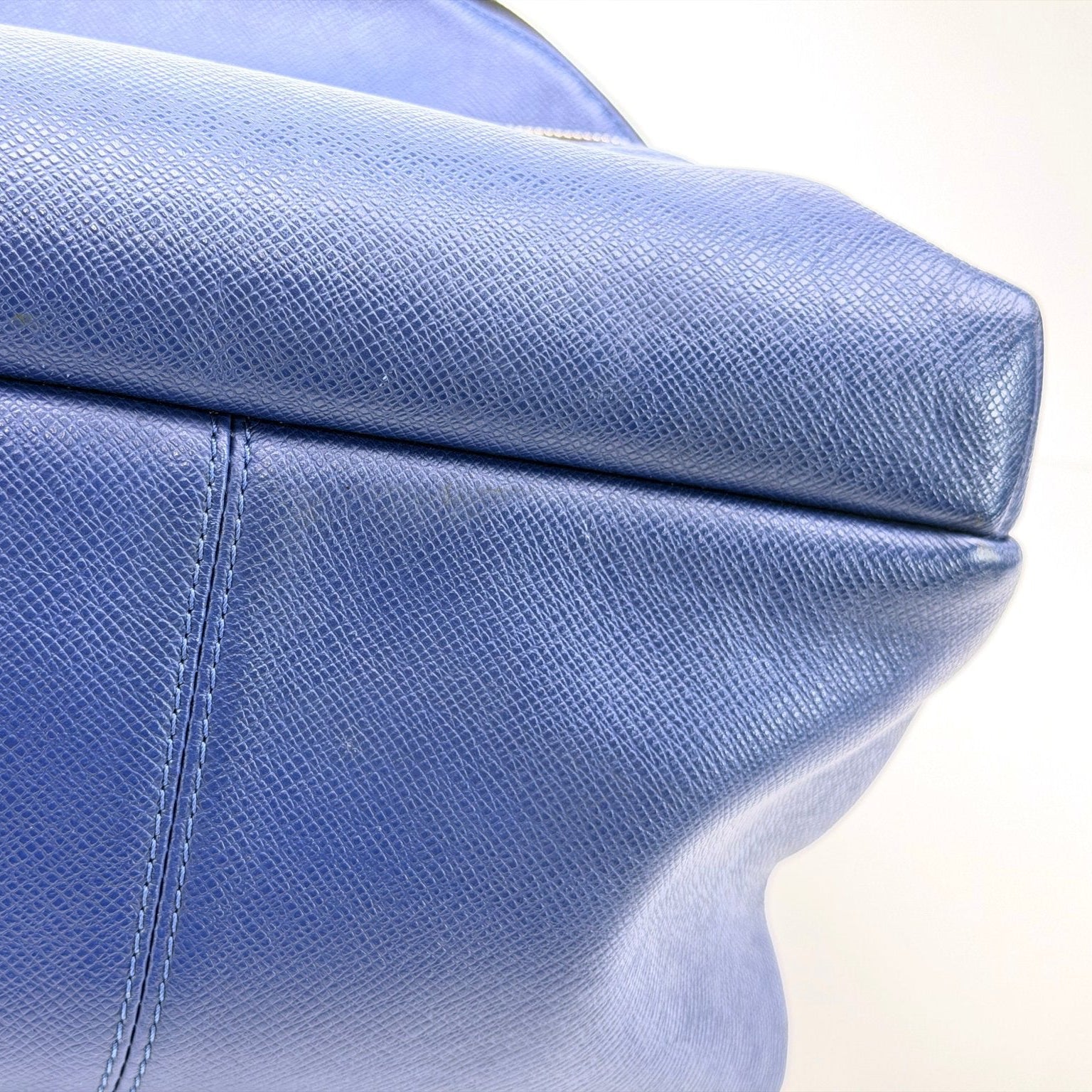 Louis Vuitton Discovery Backpack in travel bag style, featuring classic monogram canvas and leather accents, displayed outdoors.