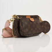 Louis Vuitton Multi Pochette handbag with gold-tone accents, featuring multiple compartments and stylish design.