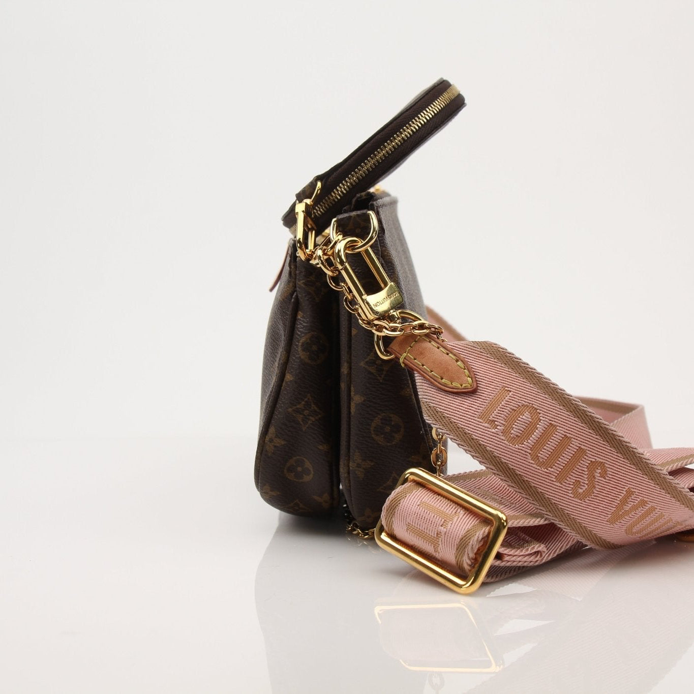 Louis Vuitton Multi Pochette handbag with gold accents, featuring multiple compartments and stylish design, by Gold & Beyond.
