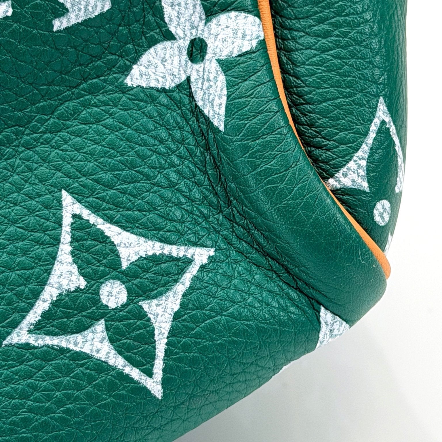 Gold & Beyond Louis Vuitton Speedy 950 travel bag in classic monogram canvas with leather handles and gold-tone hardware.