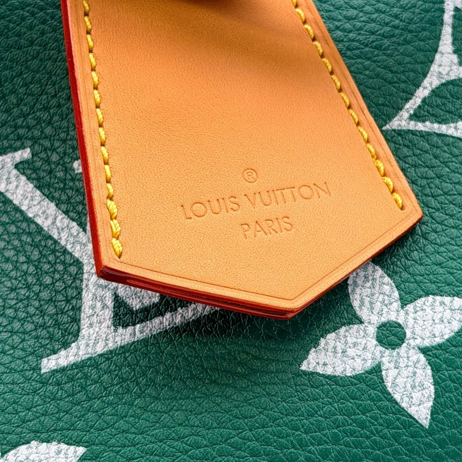 Gold & Beyond Louis Vuitton Speedy 950 travel bag with leather handles and classic monogram canvas, showcasing its spacious design.