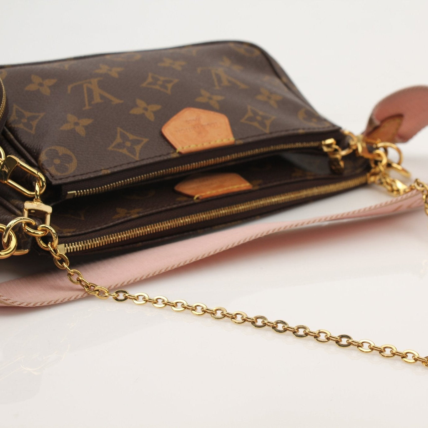 Louis Vuitton Multi Pochette handbag from Gold & Beyond, featuring multiple compartments and stylish design.