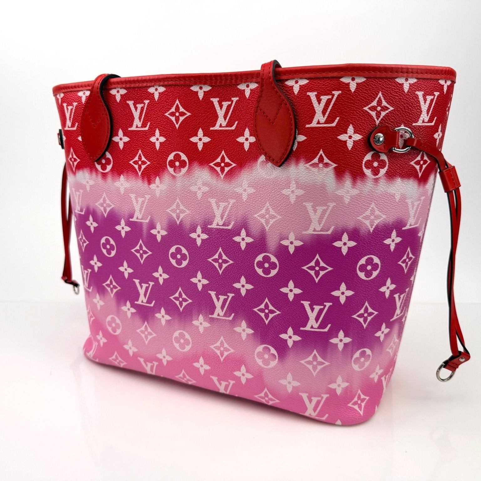 Louis Vuitton Neverfull Escale tote handbag by Gold & Beyond with colorful patterned fabric and leather straps.