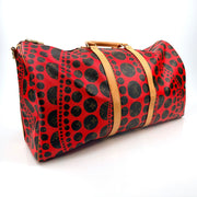 Louis Vuitton x Yayoi Kusama polka dot travel bag by Gold & Beyond, featuring vibrant red and black dotted design with sturdy handles.