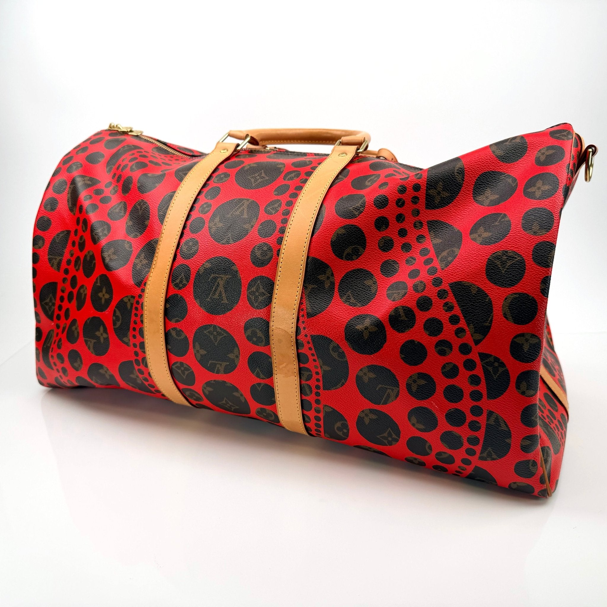 Louis Vuitton x Yayoi Kusama polka dot travel bag by Gold & Beyond, featuring vibrant dot patterns and spacious design.