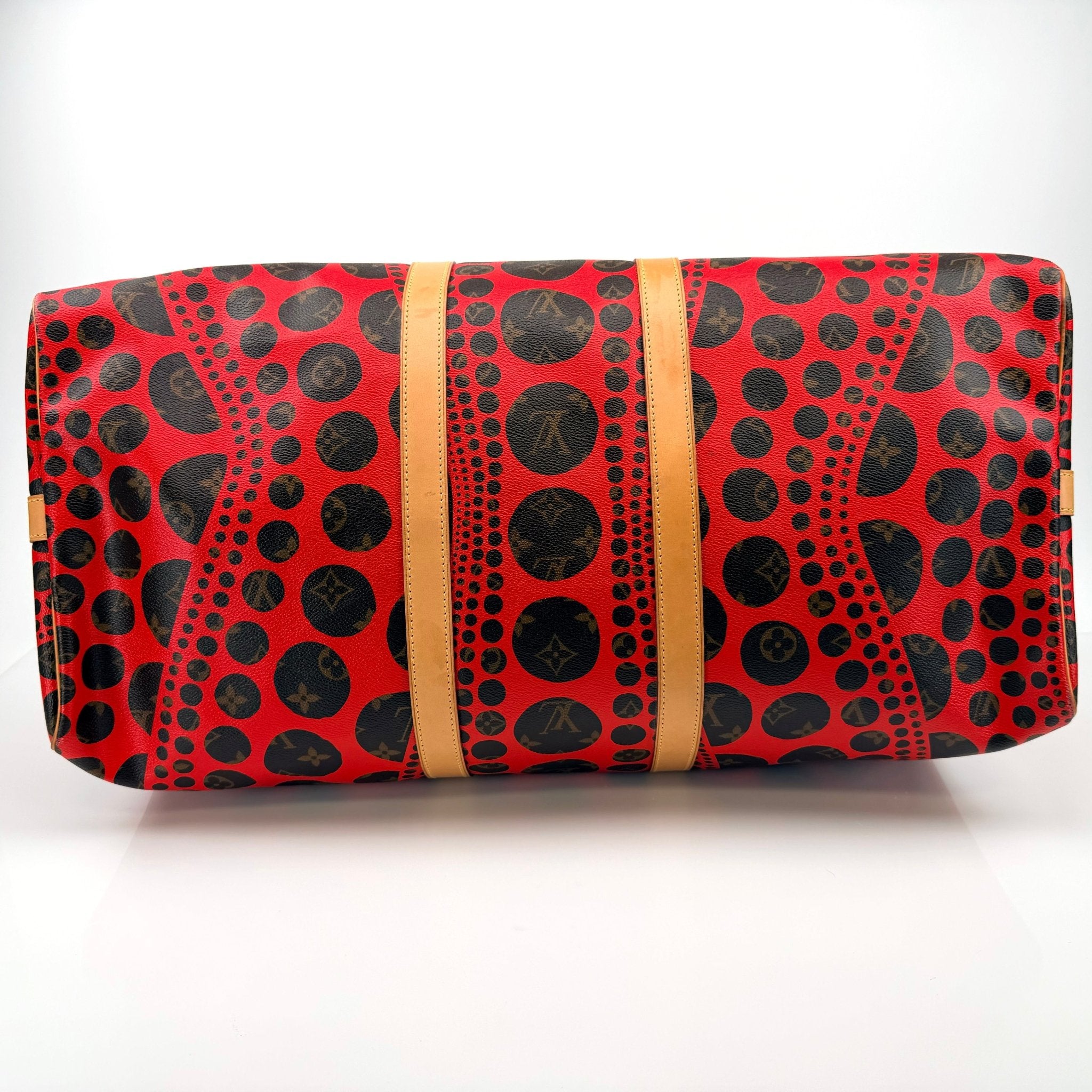 Louis Vuitton x Yayoi Kusama polka dot travel bag by Gold & Beyond, showcasing vibrant pattern and spacious design.