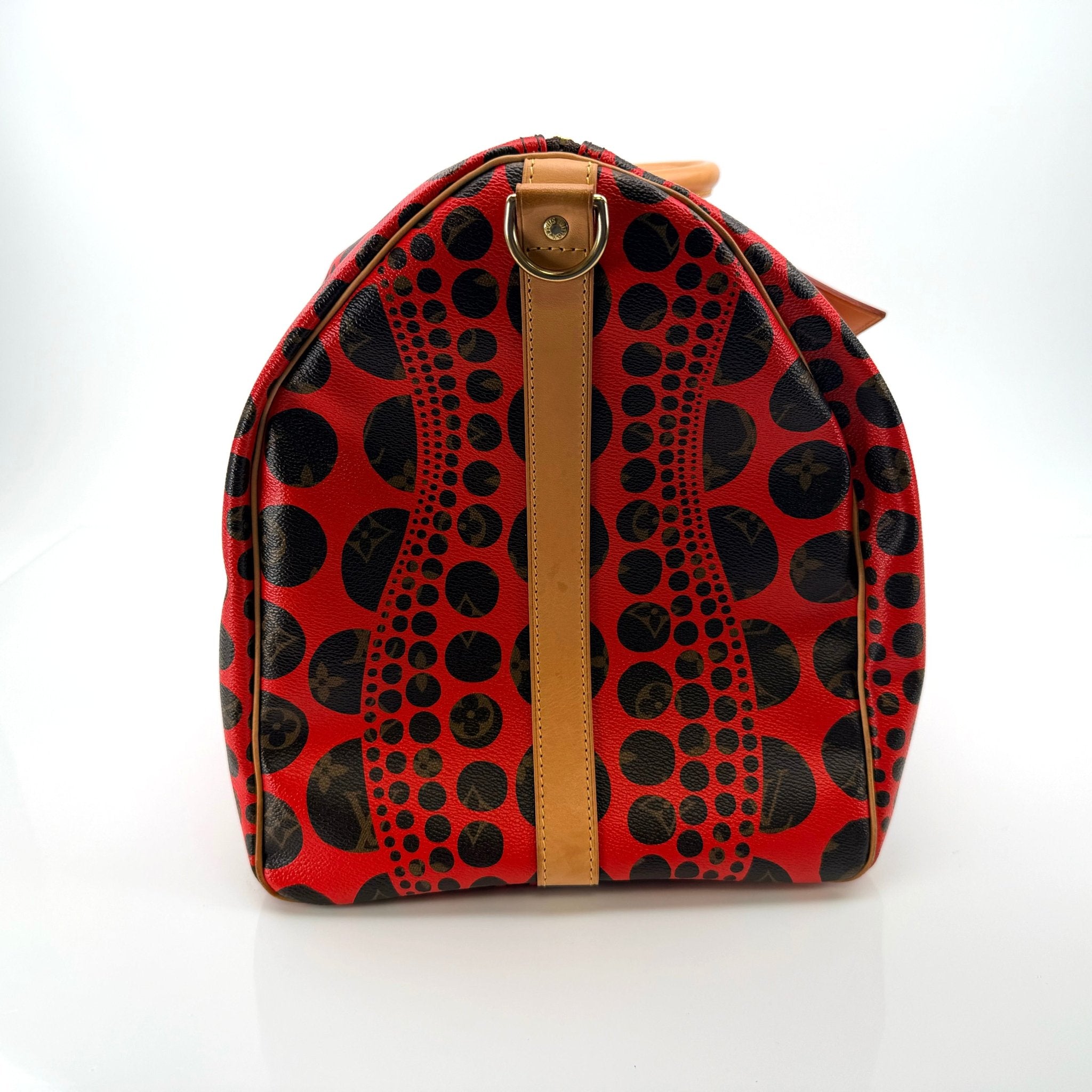 Louis Vuitton x Yayoi Kusama polka dot travel bag by Gold & Beyond, featuring vibrant pattern and spacious design.