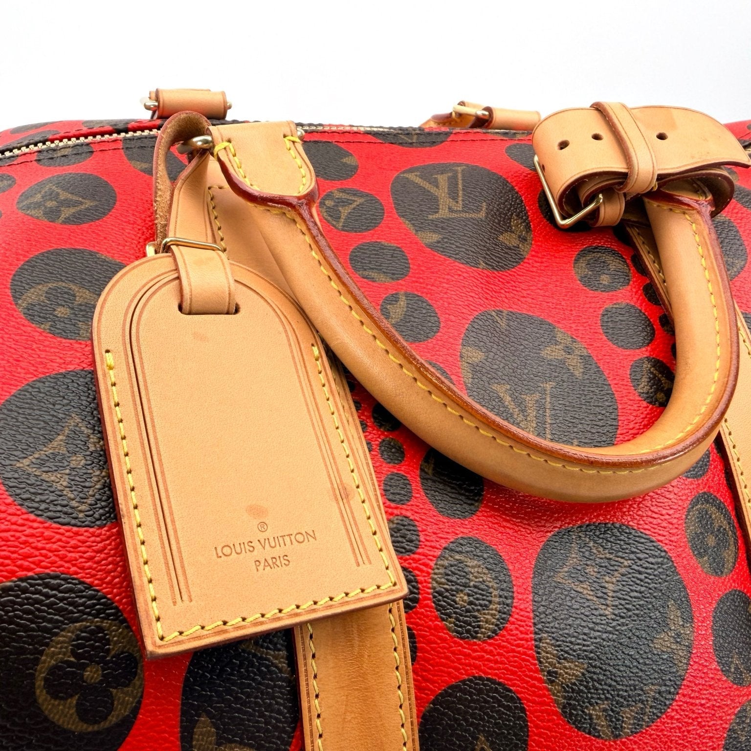 Louis Vuitton x Yayoi Kusama polka dot travel bag by Gold & Beyond, featuring vibrant polka dot design and spacious storage.