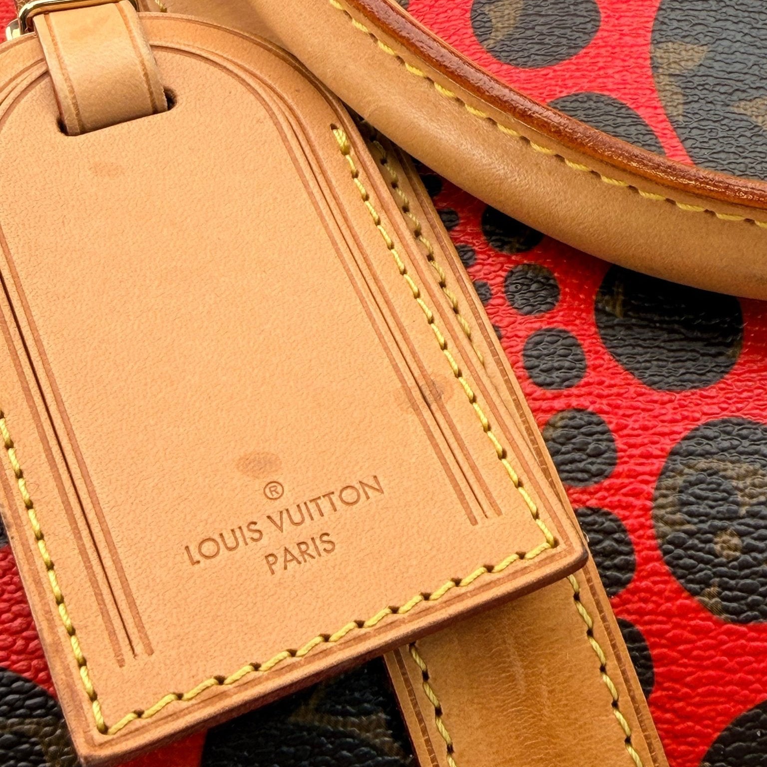 Louis Vuitton x Yayoi Kusama polka dot travel bag by Gold & Beyond, featuring distinctive polka dot pattern and spacious design.