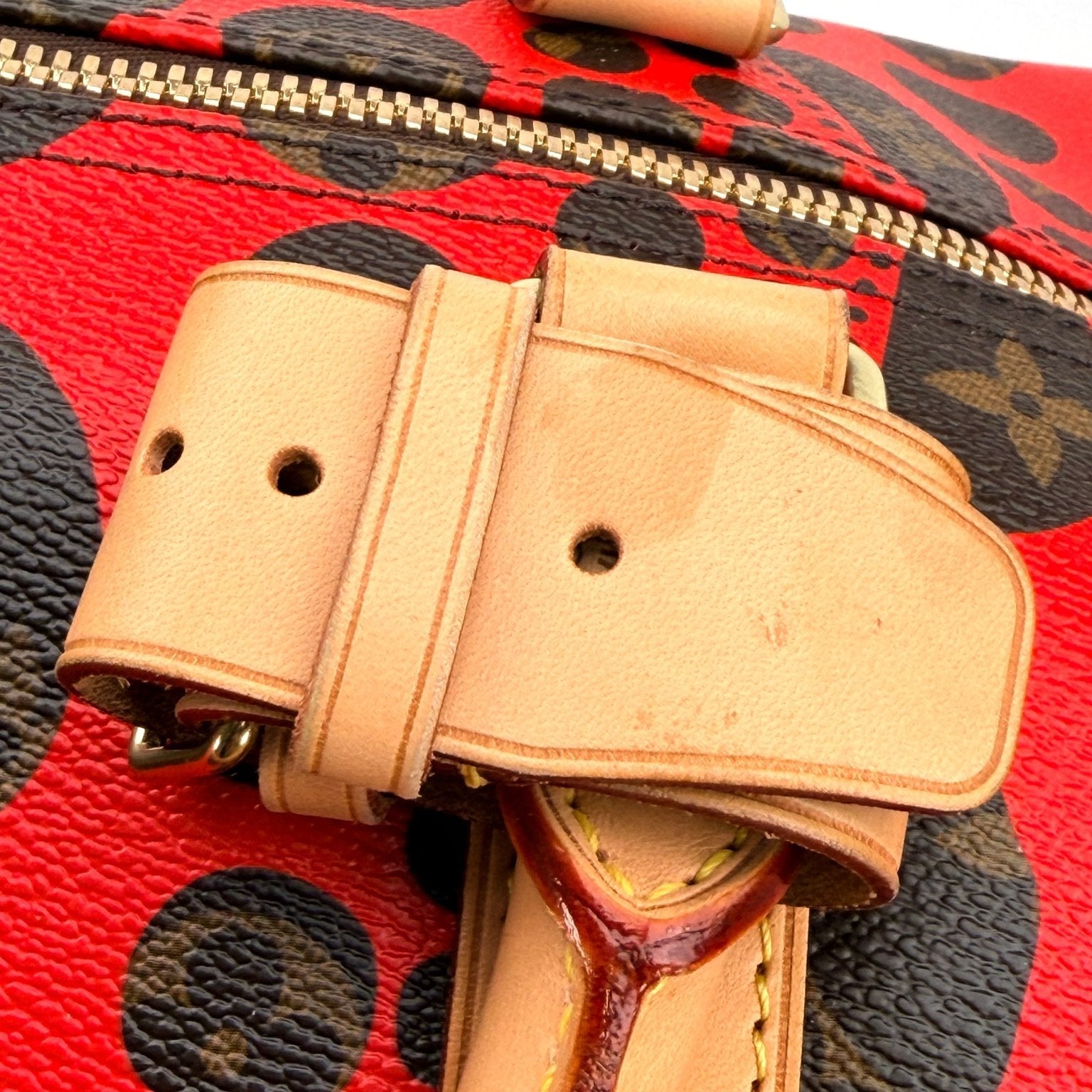 Louis Vuitton x Yayoi Kusama polka dot travel bag by Gold & Beyond, showcasing vibrant dotted design and spacious interior.