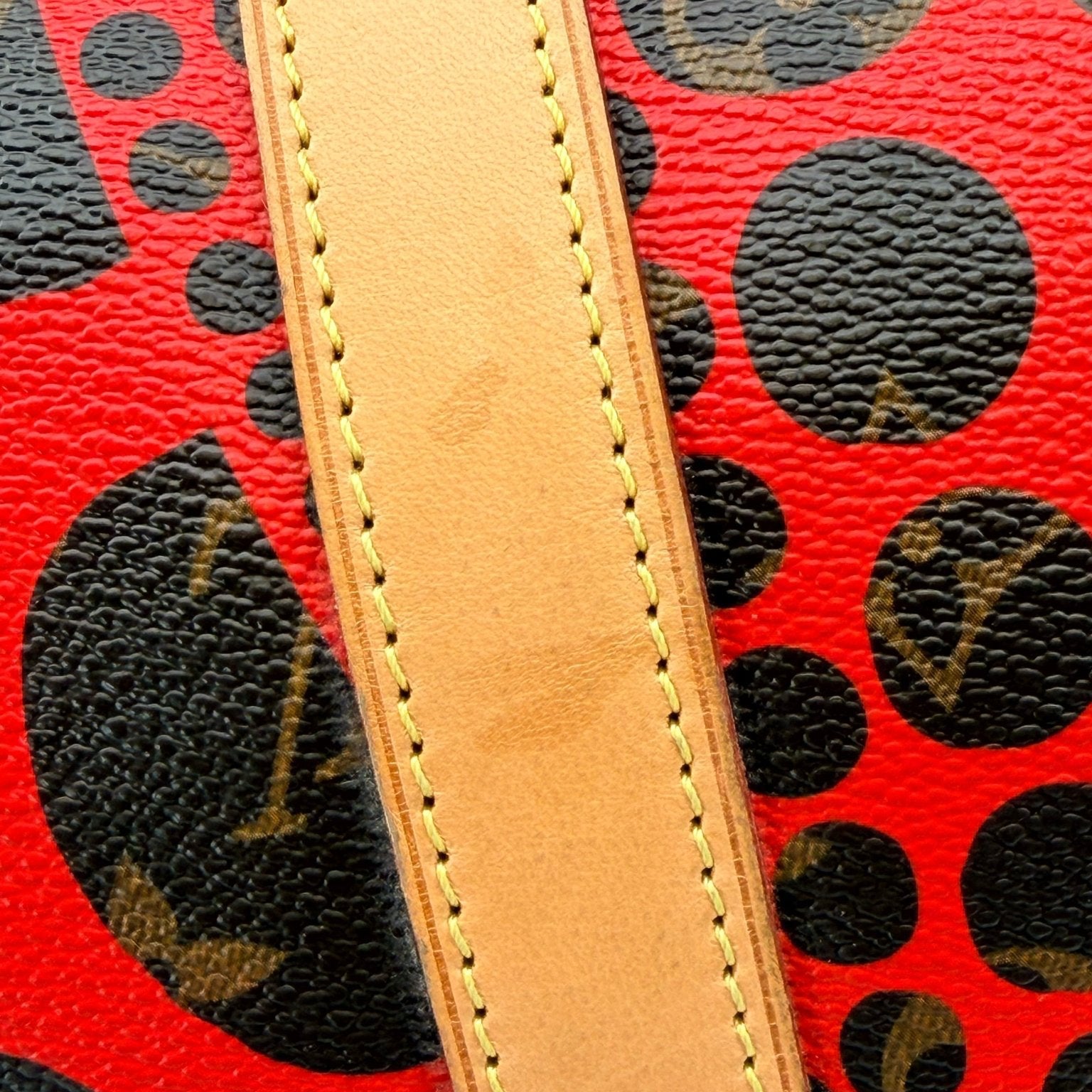 Louis Vuitton x Yayoi Kusama polka dot travel bag by Gold & Beyond, featuring vibrant pattern and spacious design.