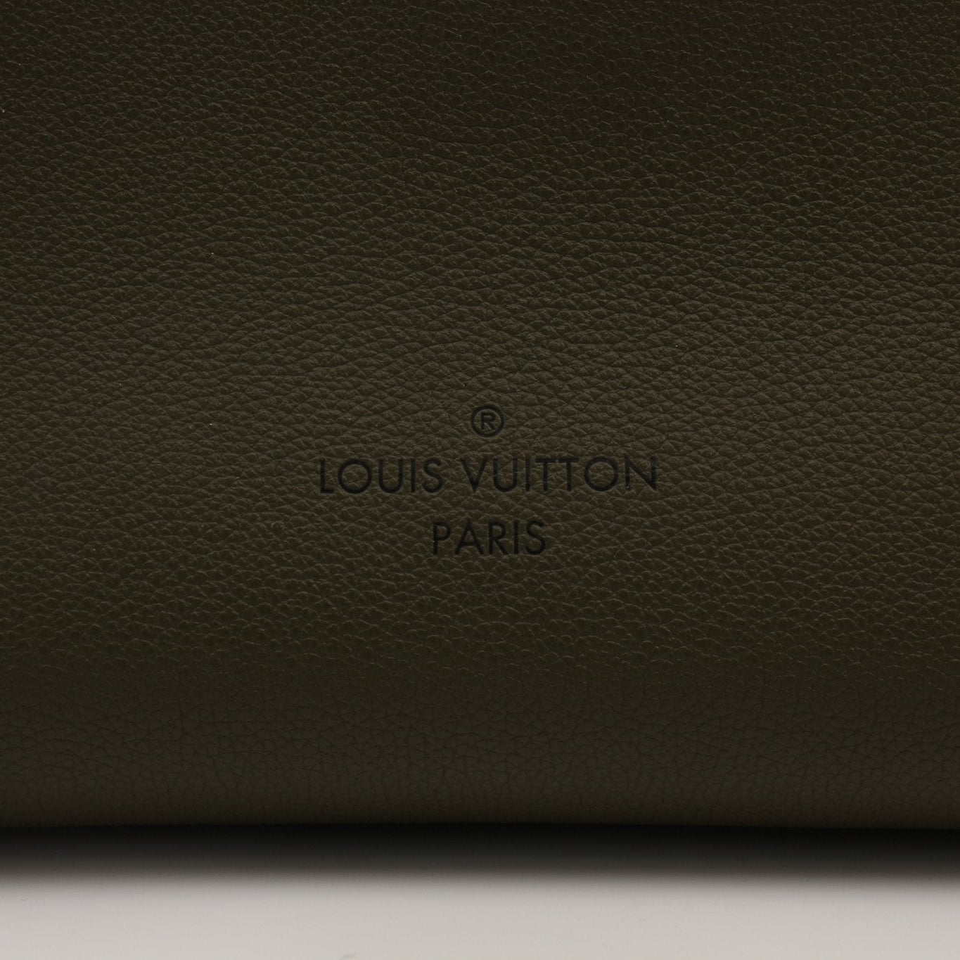 Louis Vuitton On My Side MM handbag in brown leather with gold hardware, featuring a structured design and top handles.