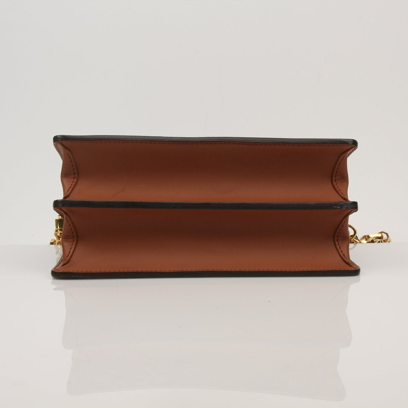 Louis Vuitton Dauphine MM handbag in beige with gold hardware, featuring structured design and monogram canvas.