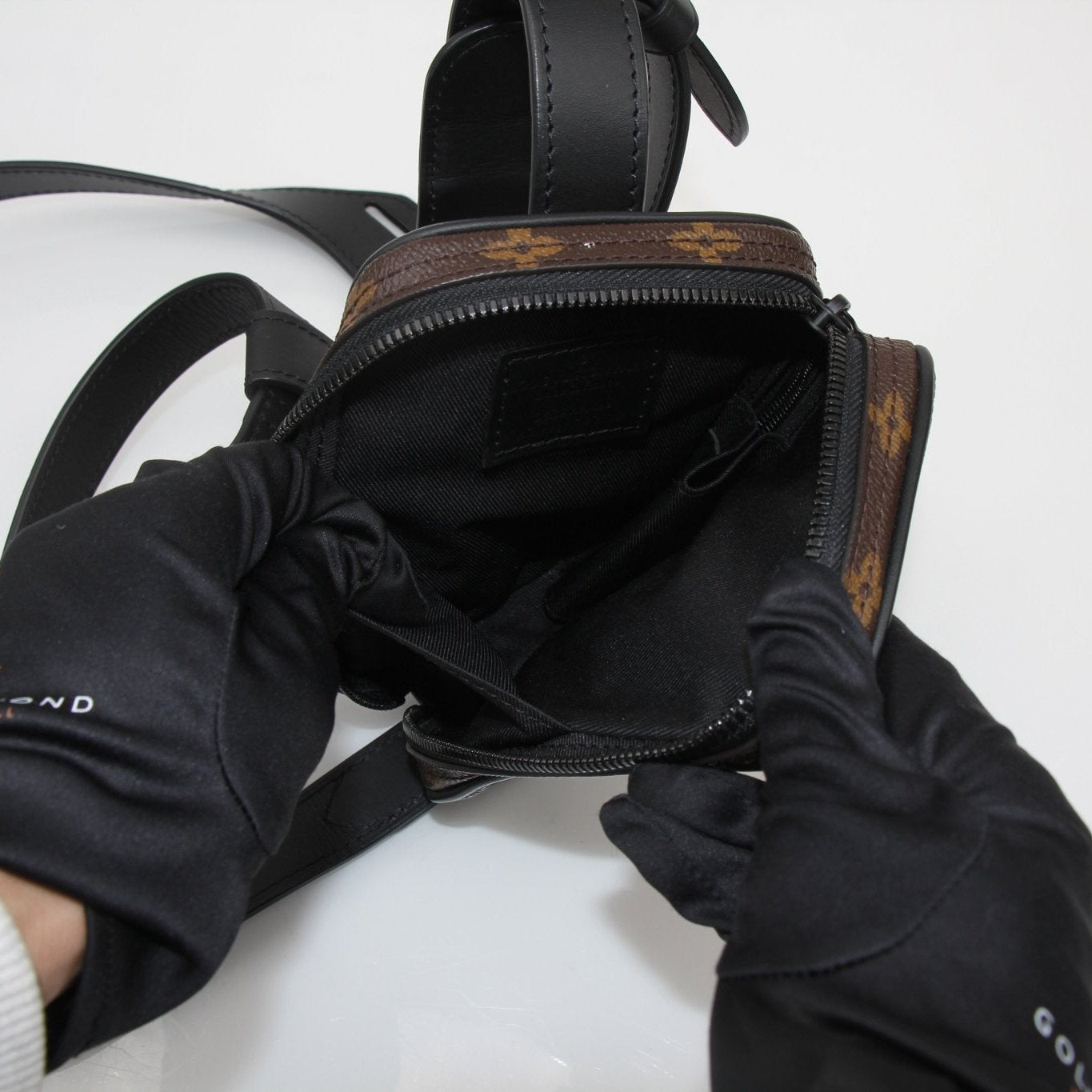 Gold & Beyond Louis Vuitton utility crossbody handbag with adjustable strap and signature monogram pattern.