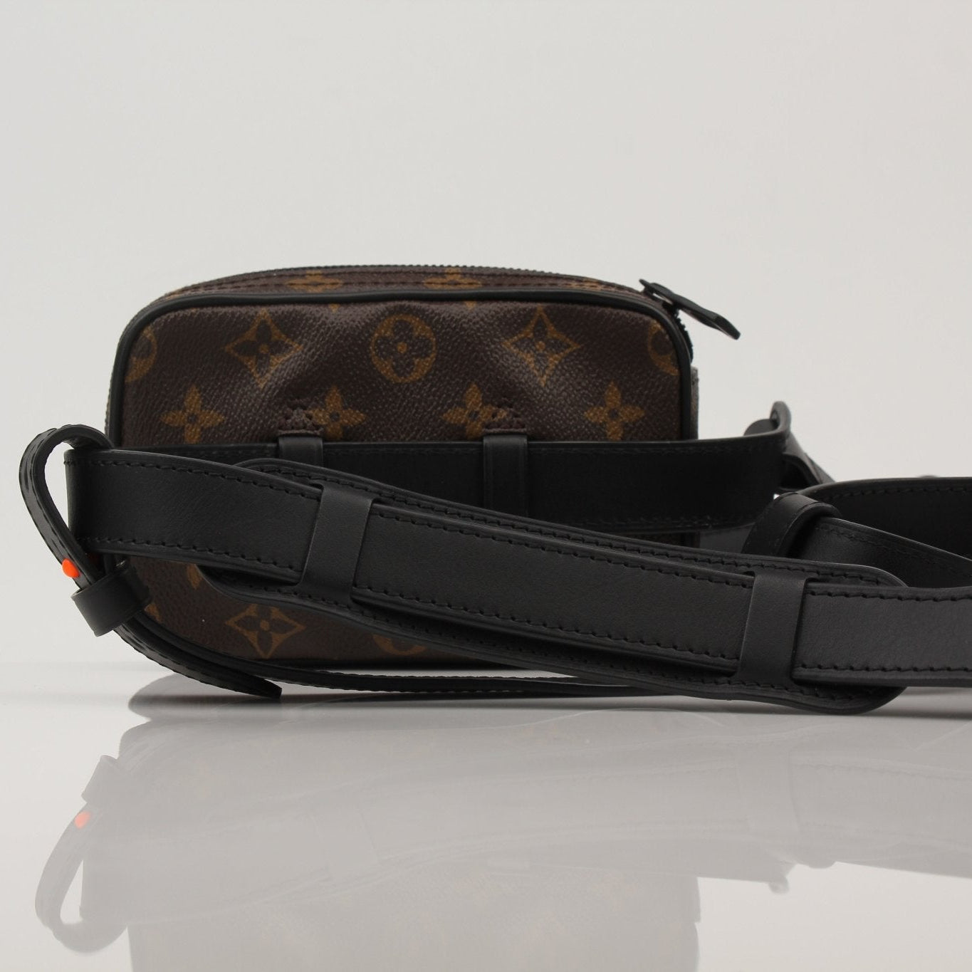 Gold & Beyond Louis Vuitton Utility Crossbody handbag with adjustable strap and sleek design, shown in a close-up view.