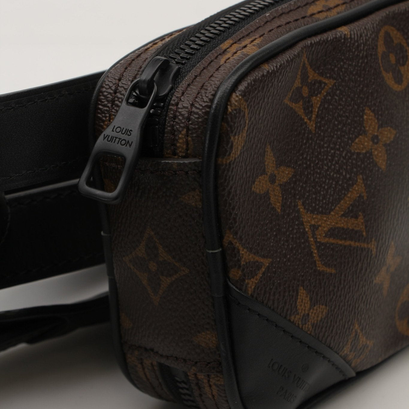 Gold & Beyond Louis Vuitton utility crossbody handbag with adjustable strap and designer logo, featuring durable material and sleek design.
