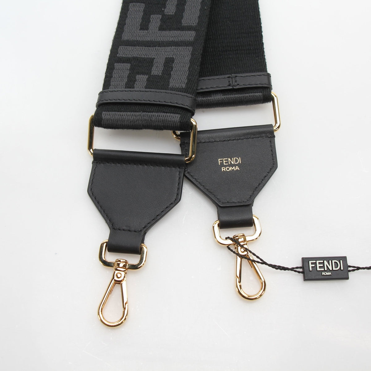 Black Fendi Strap You FF Jacquard adjustable shoulder strap for accessories, featuring the iconic pattern and branding details.