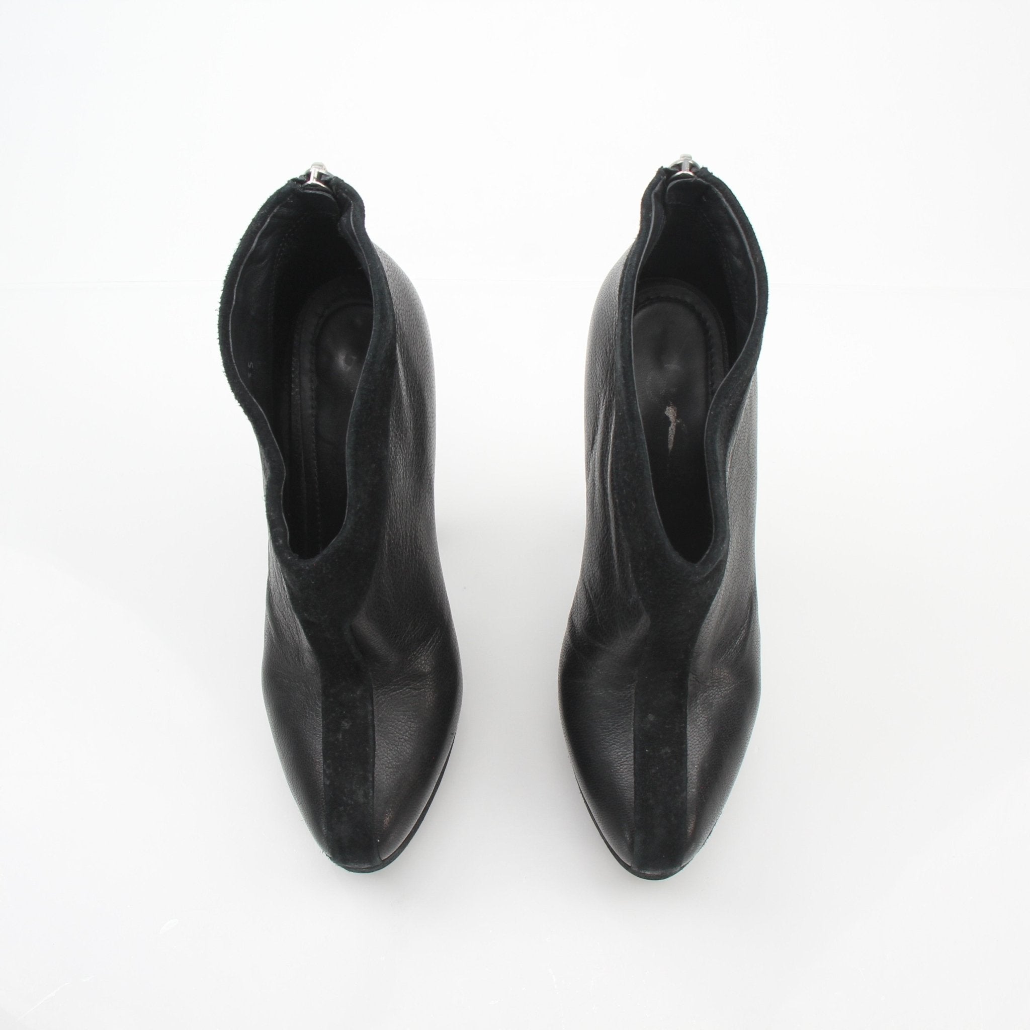Black leather Saint Laurent Rive Gauche ankle platform pumps with heels, featuring a sleek and stylish design.