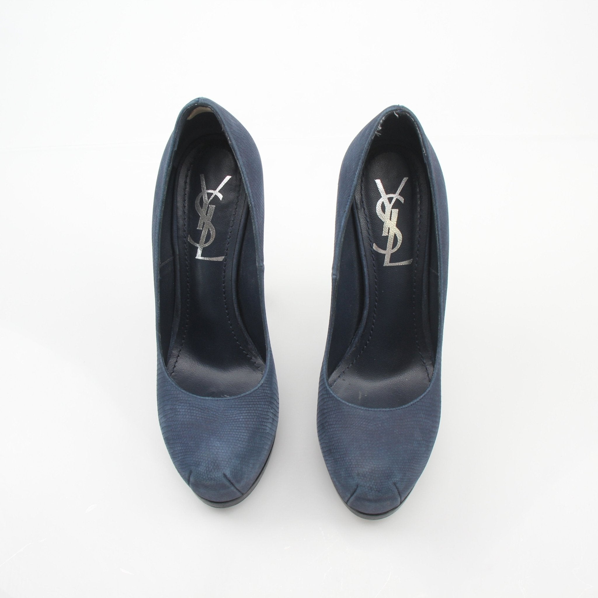 Navy suede Saint Laurent Tribute Two platform heels with chunky heel and cut-out design, photographed on a plain background.