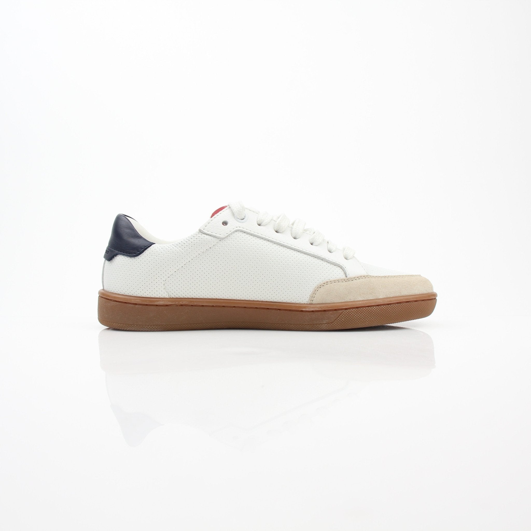 White leather Saint Laurent Court Classic SL/10 low top sneakers with gold accents, displayed on a plain background.