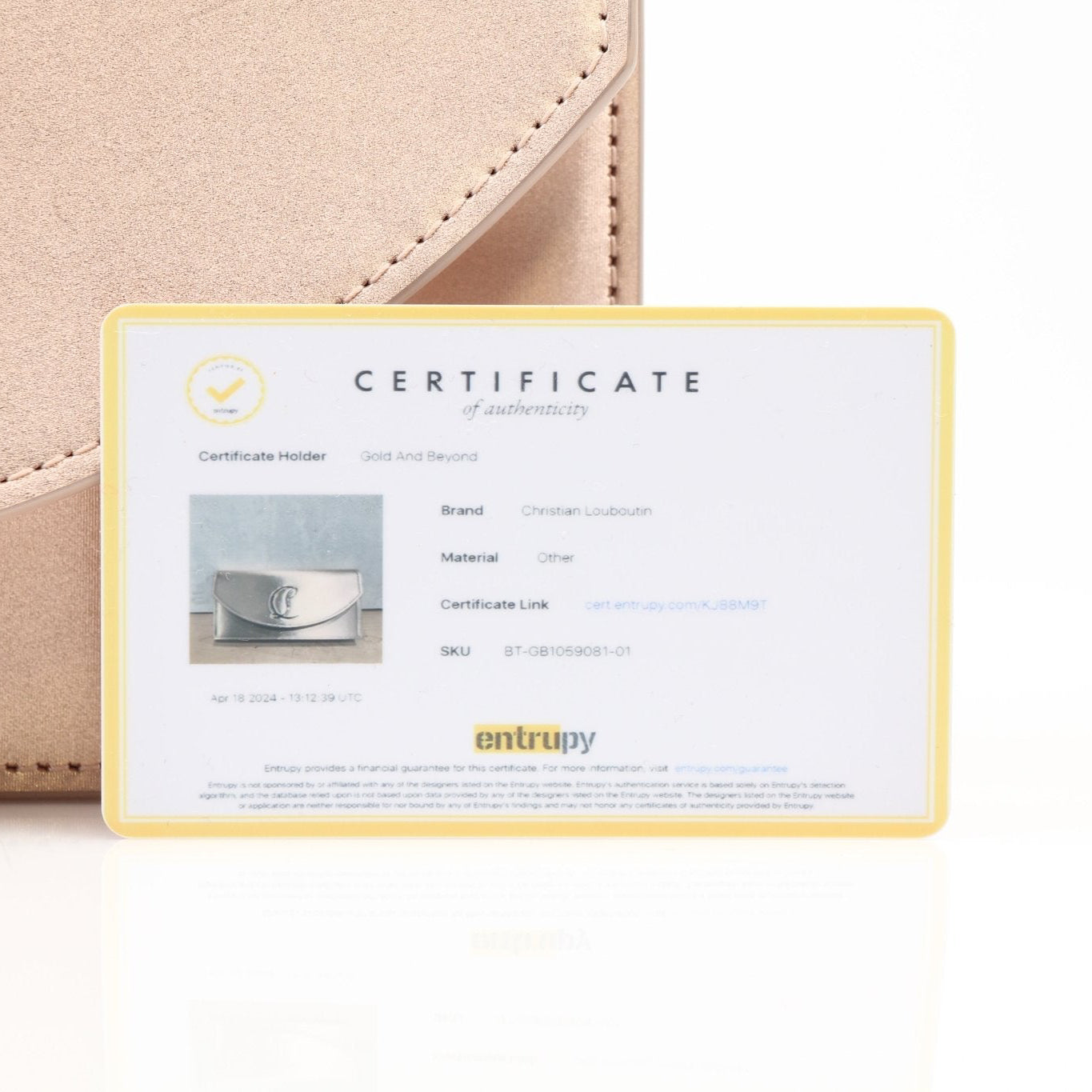 Christian Louboutin Loubi54 satin clutch handbag with gold accents, stylish evening accessory with elegant design.