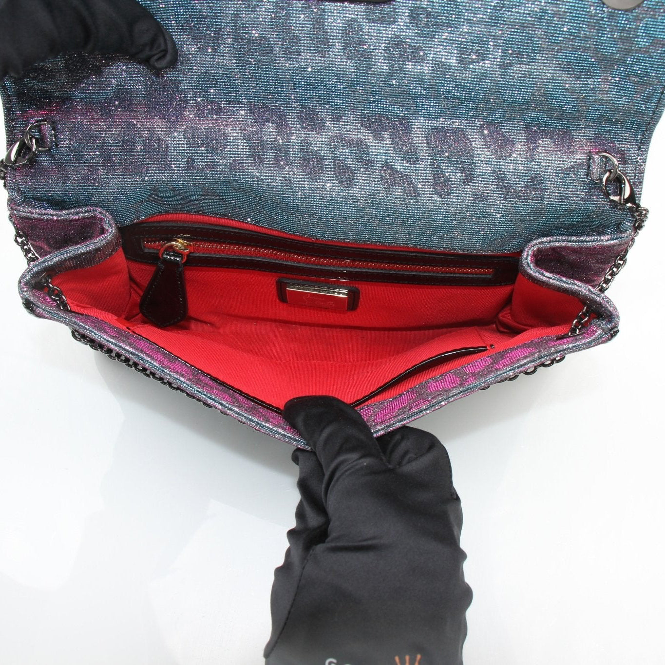 Christian Louboutin Paloma handbag with gold accents, featuring a sleek design and elegant craftsmanship.