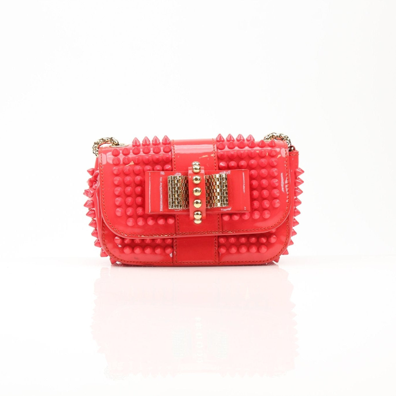 Christian Louboutin Spiked Sweet Charity Mini Bag in black with gold-tone spikes, stylish handbag with a top handle and elegant design