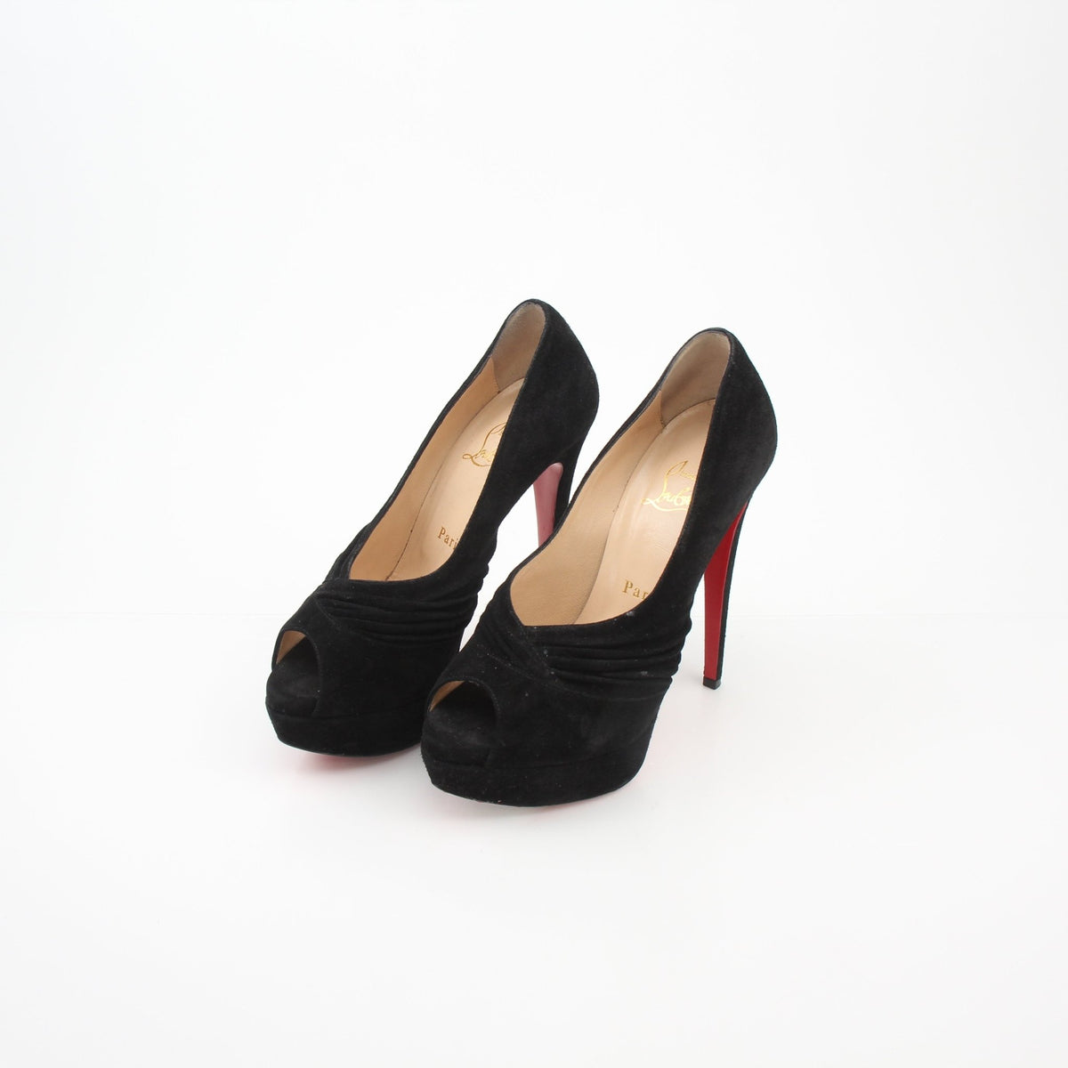 Christian Louboutin Drapadita black suede platform heels with stiletto design and signature red soles, displayed on a neutral background.