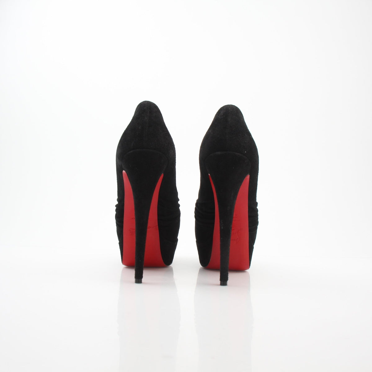 Christian Louboutin Drapadita black suede platform heels with stiletto design and signature red sole detail.