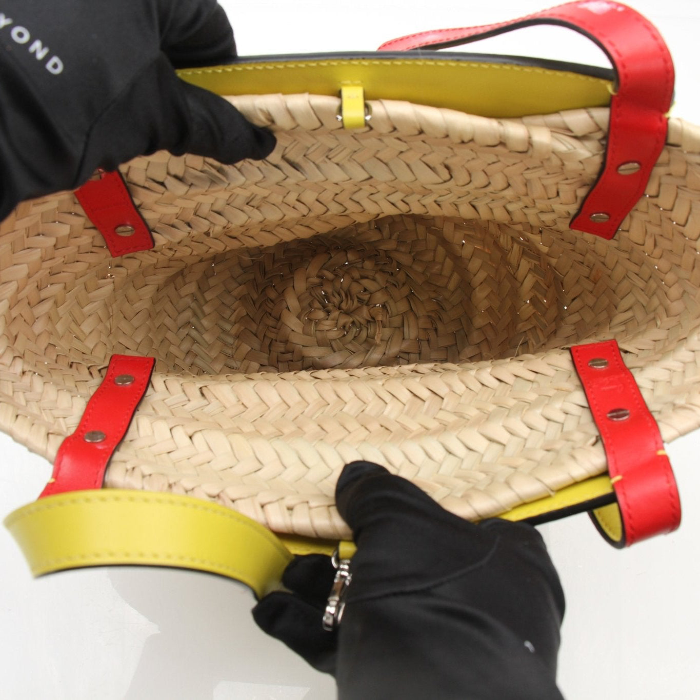 Christian Louboutin Raffia Shoulder Bag handbag with gold accents and woven raffia material, stylish and elegant for everyday wear.