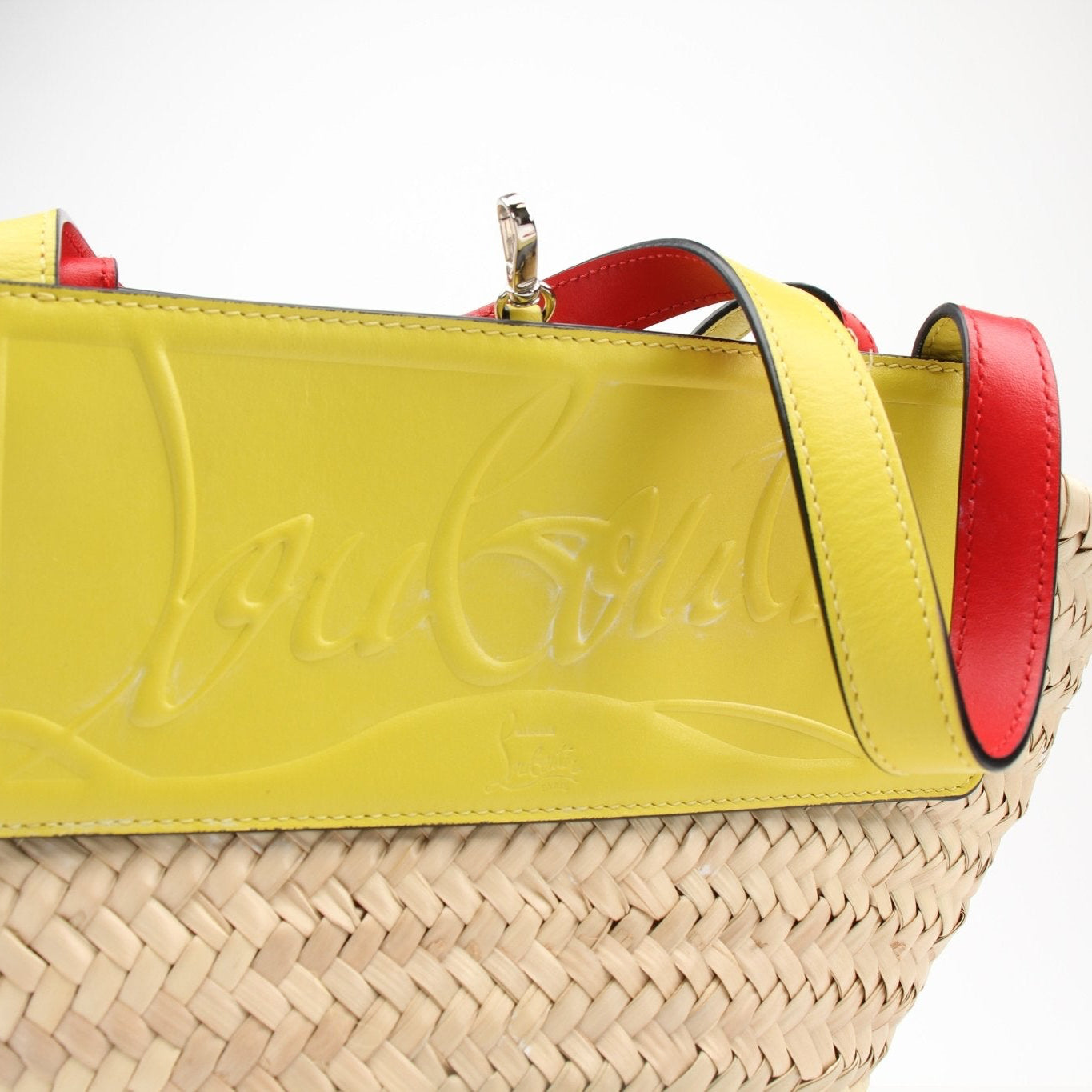 Christian Louboutin Raffia Shoulder Bag handbag with gold accents, featuring woven raffia material and stylish design.