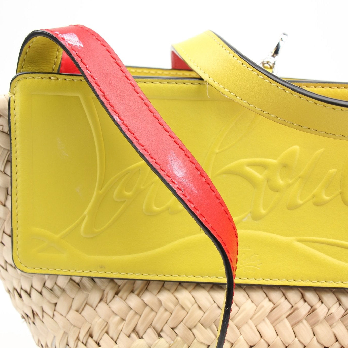 Christian Louboutin Raffia Shoulder Bag, stylish handbag with woven raffia material and gold-tone accents, designed by Gold & Beyond.