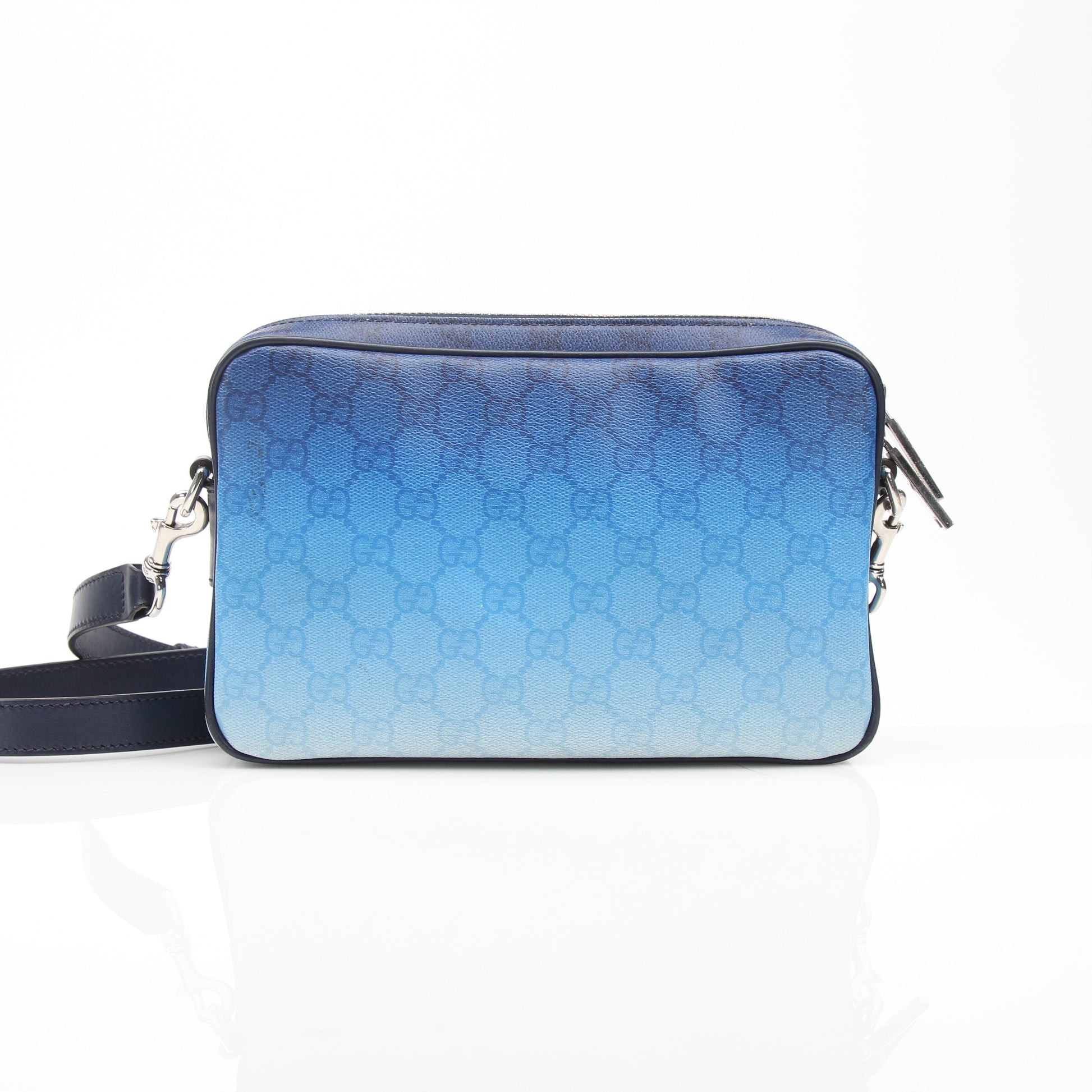 Gucci blue gradient GG crossbody handbag with gold hardware and adjustable strap, stylish and compact accessory.