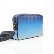 Gucci blue gradient GG crossbody handbag with gold hardware and adjustable strap, stylish accessory for everyday wear.