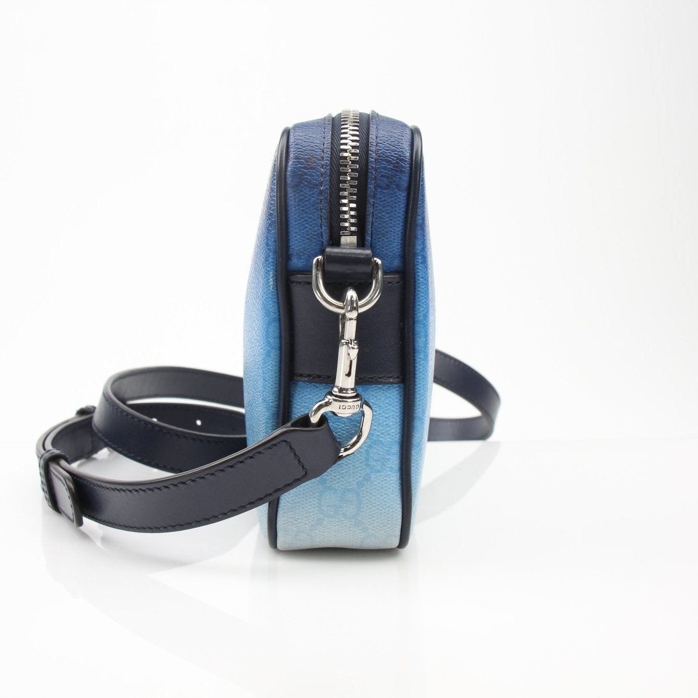 Gucci blue gradient GG crossbody handbag with gold hardware, stylish and compact for everyday use.