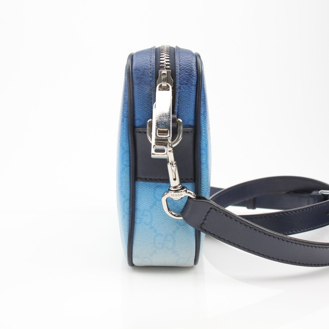Gucci blue gradient GG crossbody handbag with adjustable strap and gold-tone hardware, stylish accessory for everyday wear.
