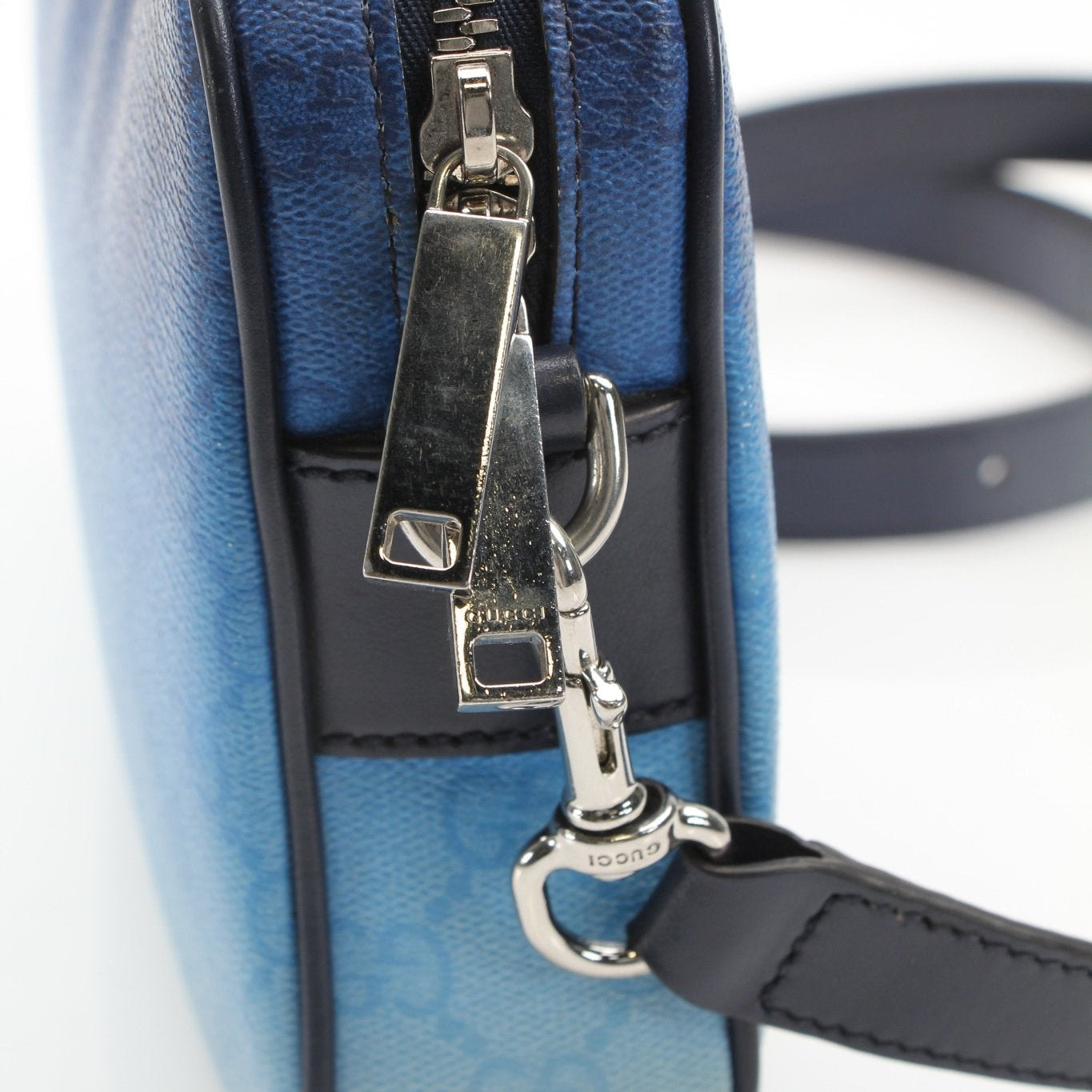 Gucci blue gradient GG crossbody handbag with gold accents, stylish fashion accessory for women.