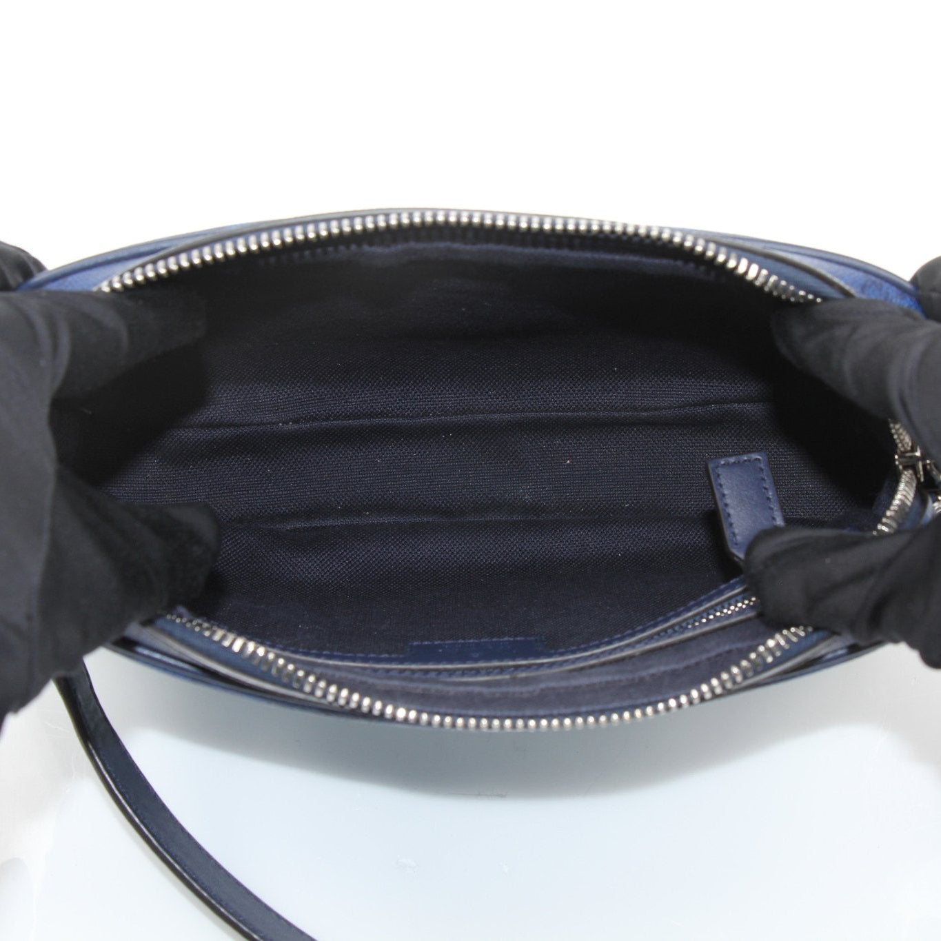 Gucci blue gradient GG crossbody handbag with gold hardware, featuring a sleek design and adjustable strap.