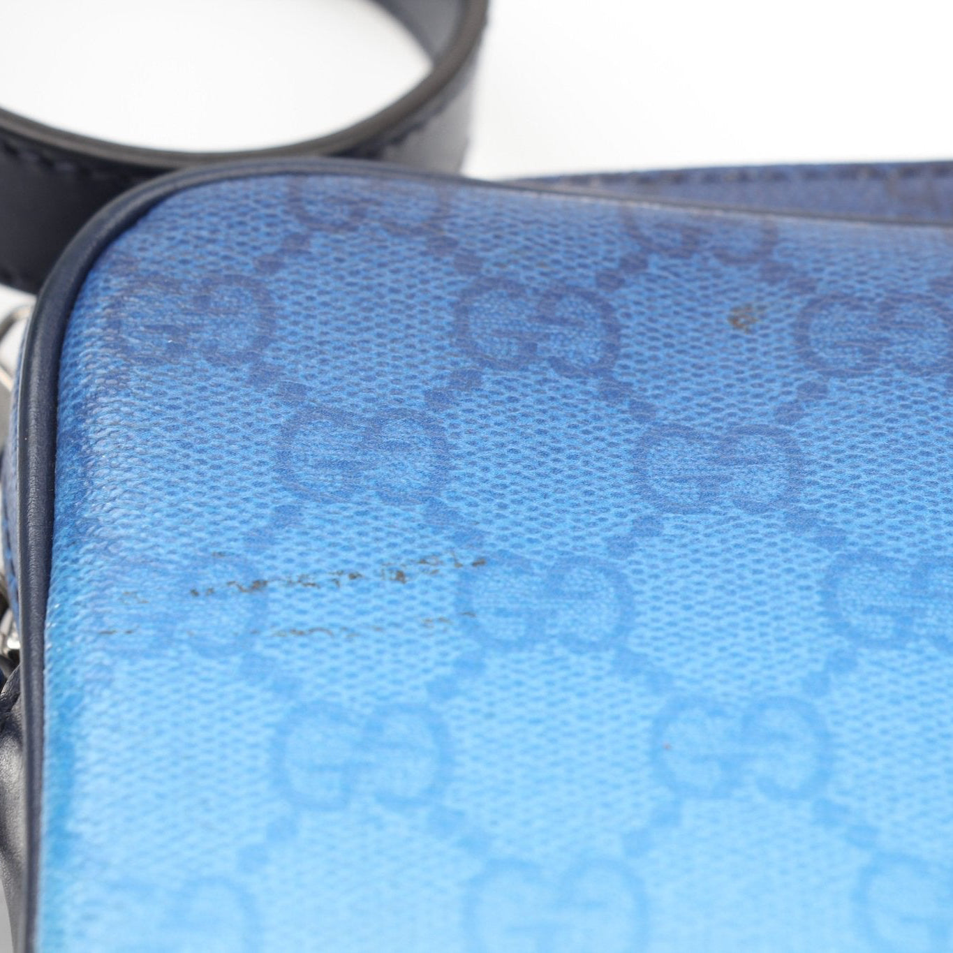 Gucci blue gradient GG crossbody handbag with gold hardware, featuring a sleek design and adjustable strap.