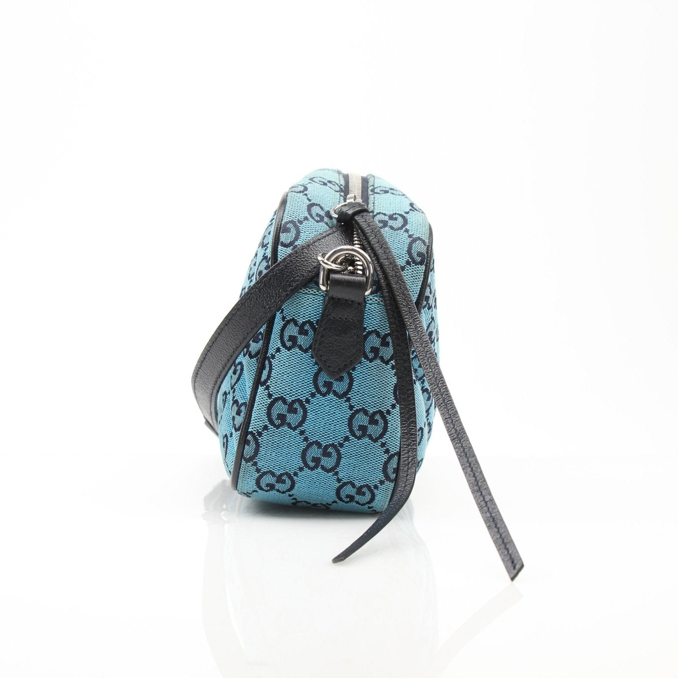 Gold & Beyond Gucci GG Marmont camera handbag with quilted leather and gold-toned hardware, shown with top handle and adjustable strap.