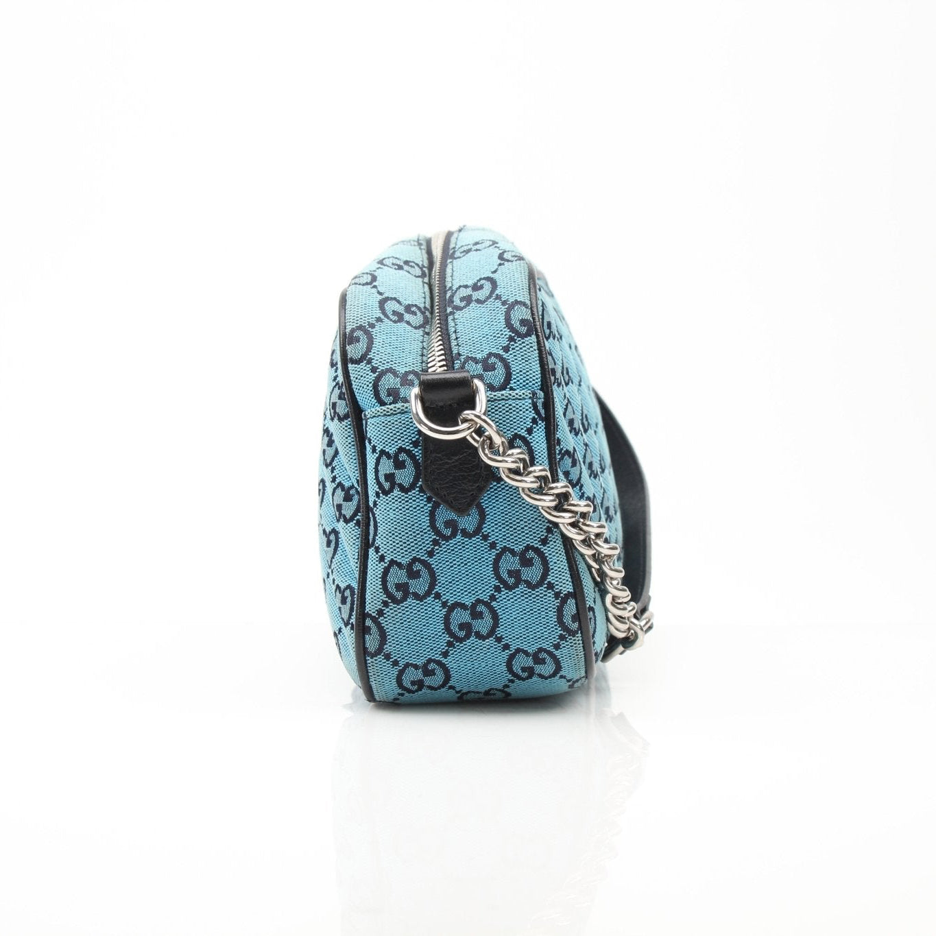 Gucci GG Marmont camera handbag in beige leather with chevron pattern and gold hardware, stylish and compact for everyday use.