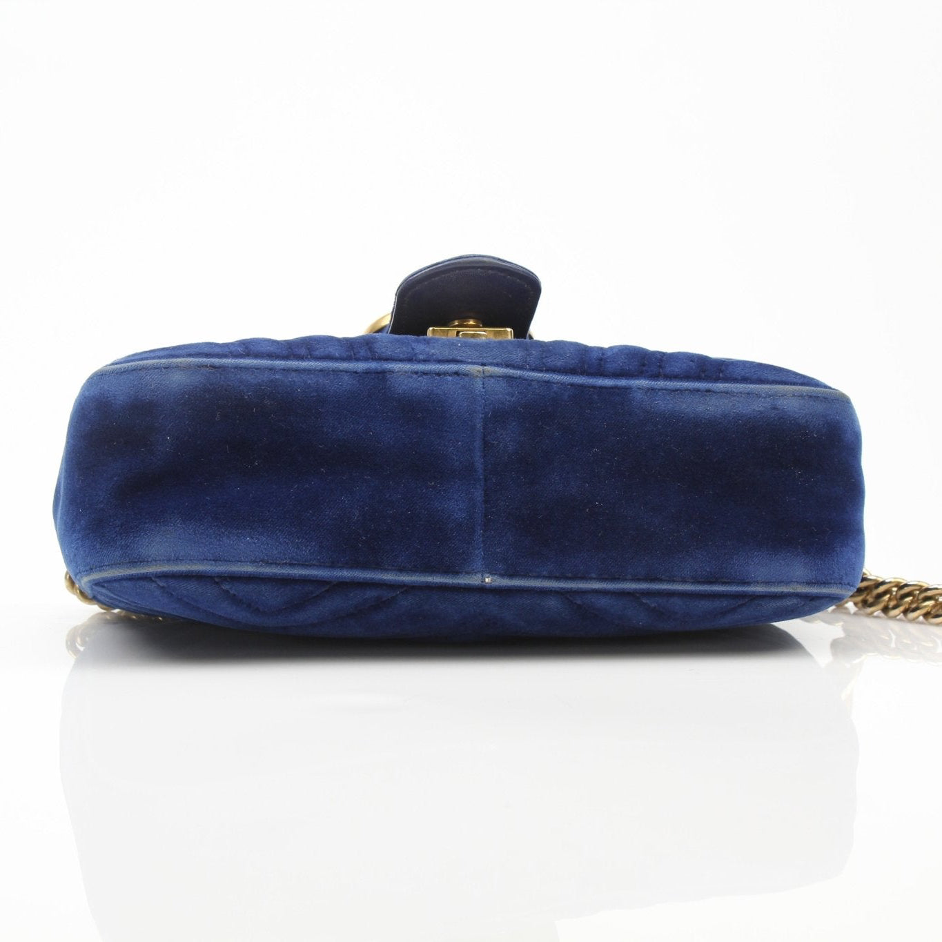 Gold & Beyond Gucci GG Marmont Mini Handbag with chevron quilted leather and gold-tone hardware, front logo, and chain strap.