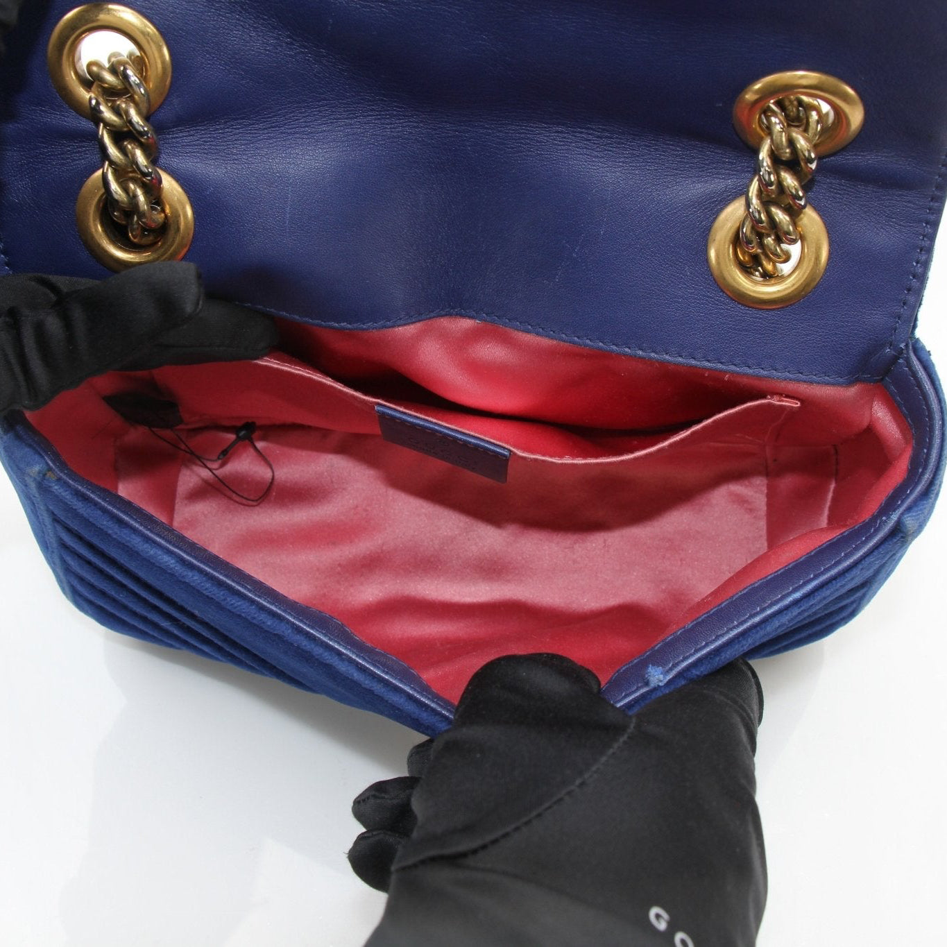 Gold & Beyond Gucci GG Marmont Mini Handbag with quilted leather and chain strap, showcasing iconic design and brand logo.